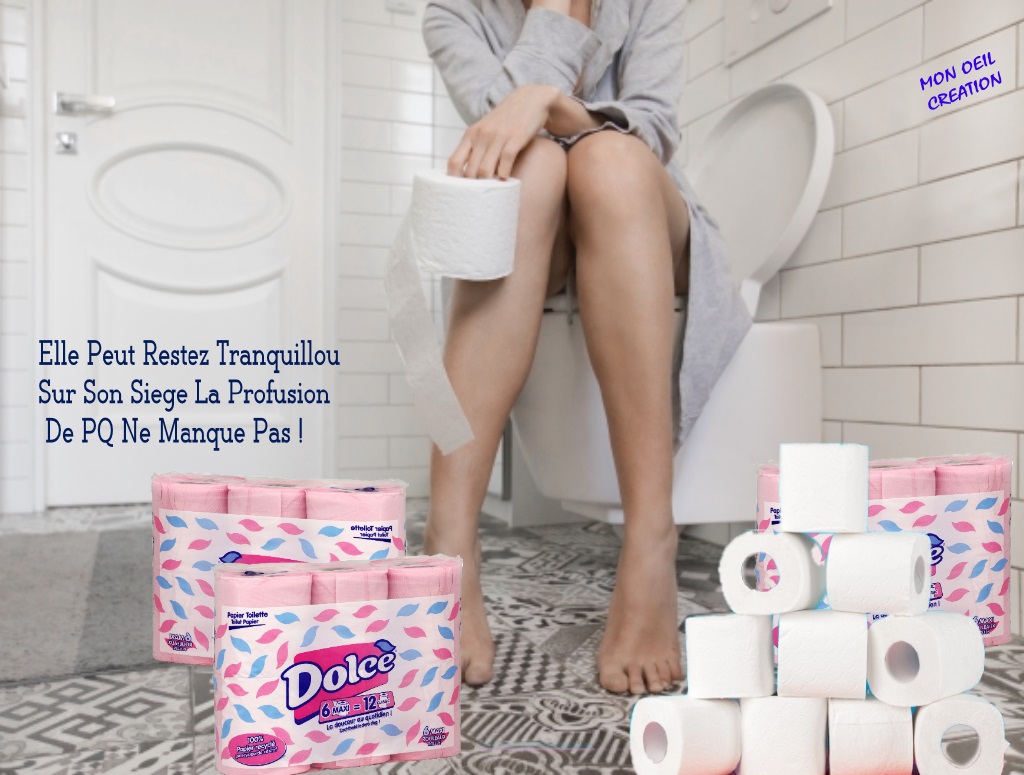 Woman sitting on the toilet holding toilet paper